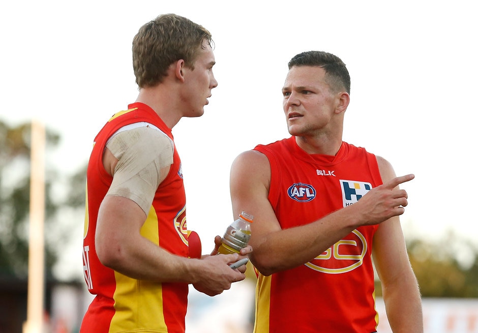 AFL 2015 Rd 16 - Gold Coast v GWS Giants GOLD COAST, AUSTRALIA - JULY 18: Tom Lynch (left) and Steven May of the Suns share a discussion after the 2015 AFL round 16 match between the Gold Coast Suns and the GWS Giants at Metricon Stadium, Gold Coast, Australia on July 18, 2015. (Photo by Michael Willson/AFL Media)